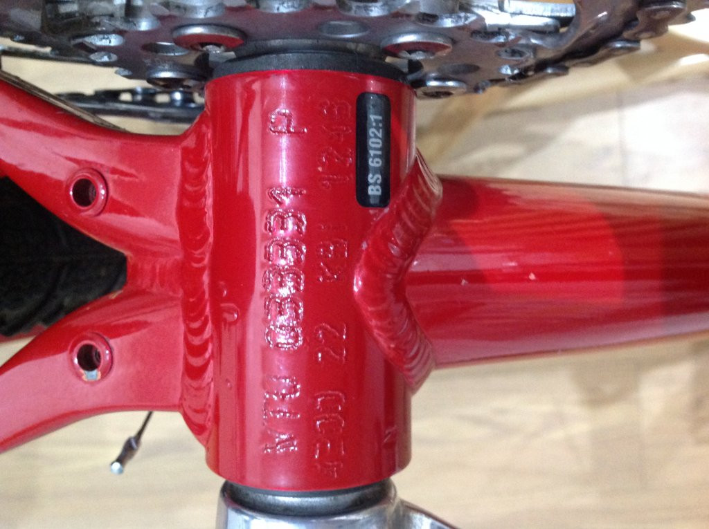 serial number between the two cranks pedals